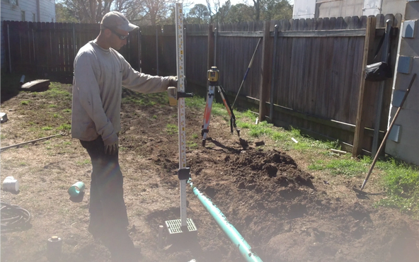 We always use a laser level to install all systems. Having proper pipe and ground slope is crucial to having the best working drainage system. Clean Cut Landscape Co.has  been solving yard drainage issues for over 35 years. Call Mario today at (504)415-1438 to get started. Backyard drainage systems near you in Metairie & New Orleans, LA. 